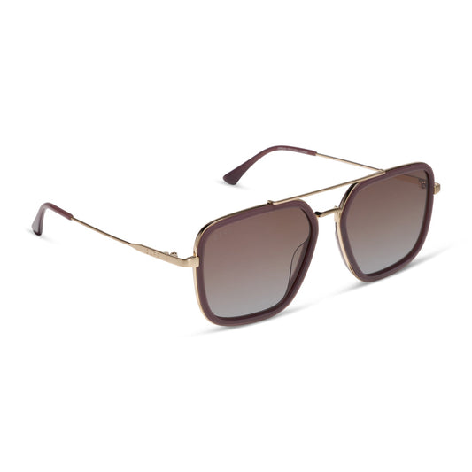 diff eyewear jordan navigator sunglasses with a cocoa powder brown frame, gold temples, and coca powder to baby blue gradient lenses angled view