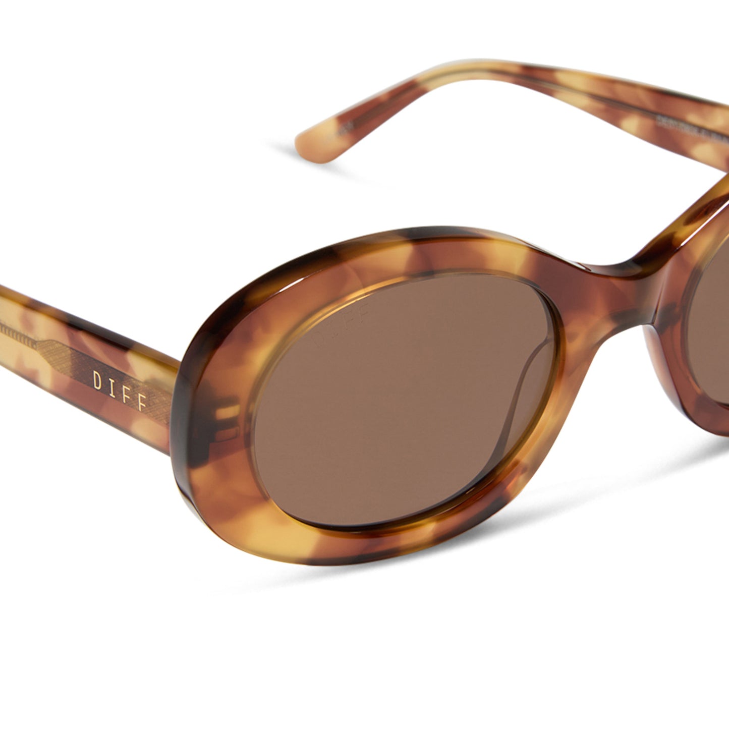 diff eyewear featuring the lainey oval sunglasses with a brown fleur frame and brown lenses detailed view