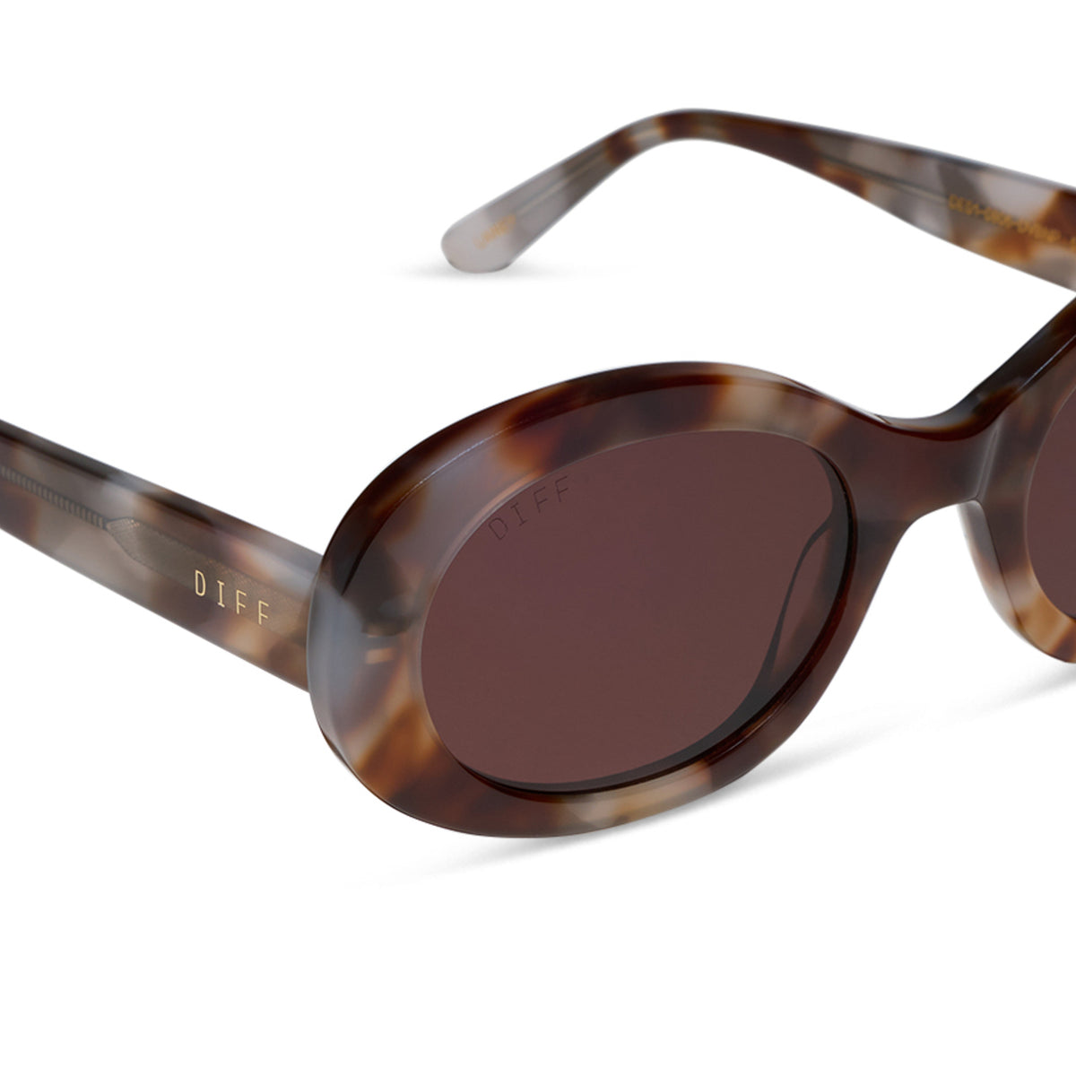 diff eyewear lainey oval sunglasses with a dove tortoise acetate frame and brown polarized lenses detailed view