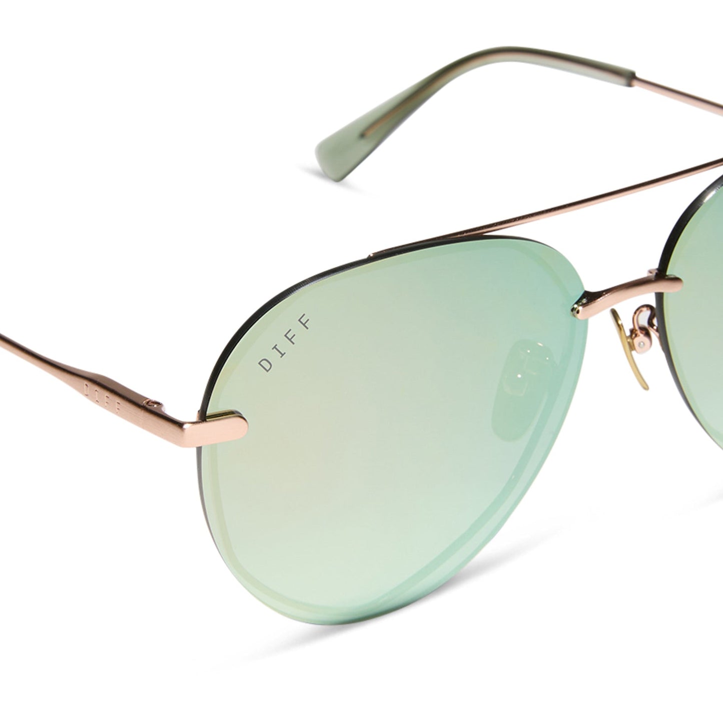 diff eyewear featuring the lenox aviator sunglasses with a brushed champagne frame and cool matcha green mirror polarized lenses detailed view