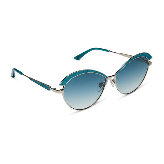 wednesday x diff eyewear featuring the bianca cat eye sunglasses with a silver frame and teal gradient lenses angled view