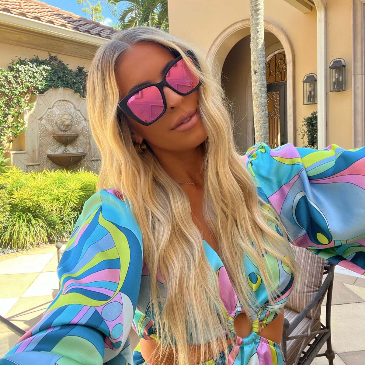 customer content - Brooke Wytiaz wearing the DIFF Eyewear Becky II cat eye sunglasses with a matte black frame and pink mirror polarized lenses
