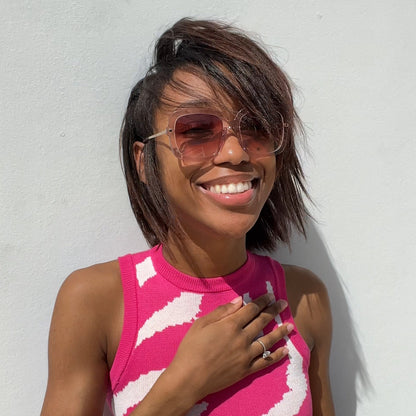 customer content - xrizztina  wearing diff eyewear sandra square sunglasses with a light pink crystal frame and peach dusk gradient lenses front view