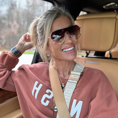 customer content - kalee rogers wearing diff eyewear dash shield oversized sunglasses with a gold metal frame and brown gradient lenses angled view