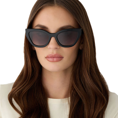 on model - female wearing the devil wears prada x diff eyewear featuring the emily cat eye sunglasses with a black acetate frame and grey gradient polarized lenses front view