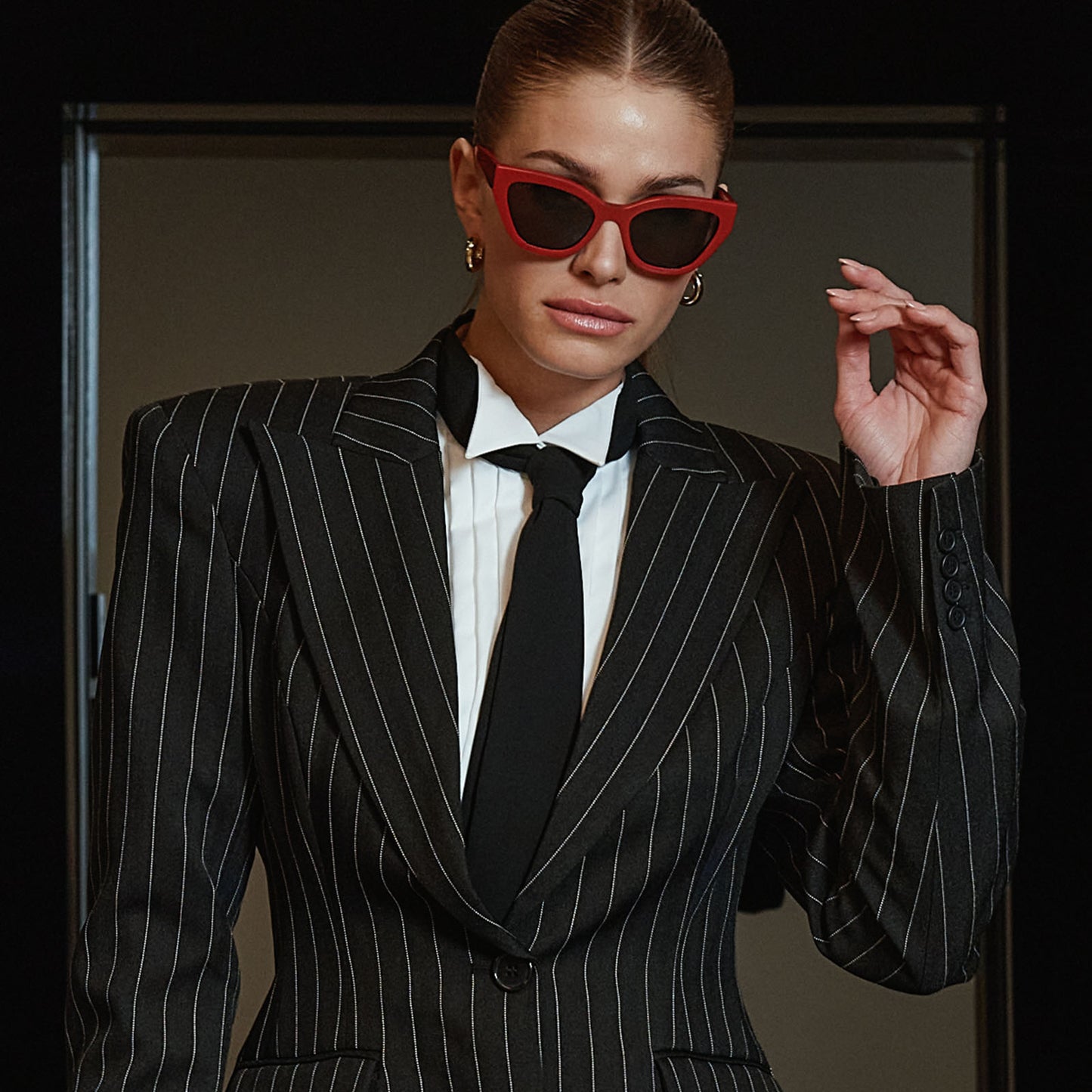 life style - business suited female wearing the devil wears prada x diff eyewear emily sunglasses in red.