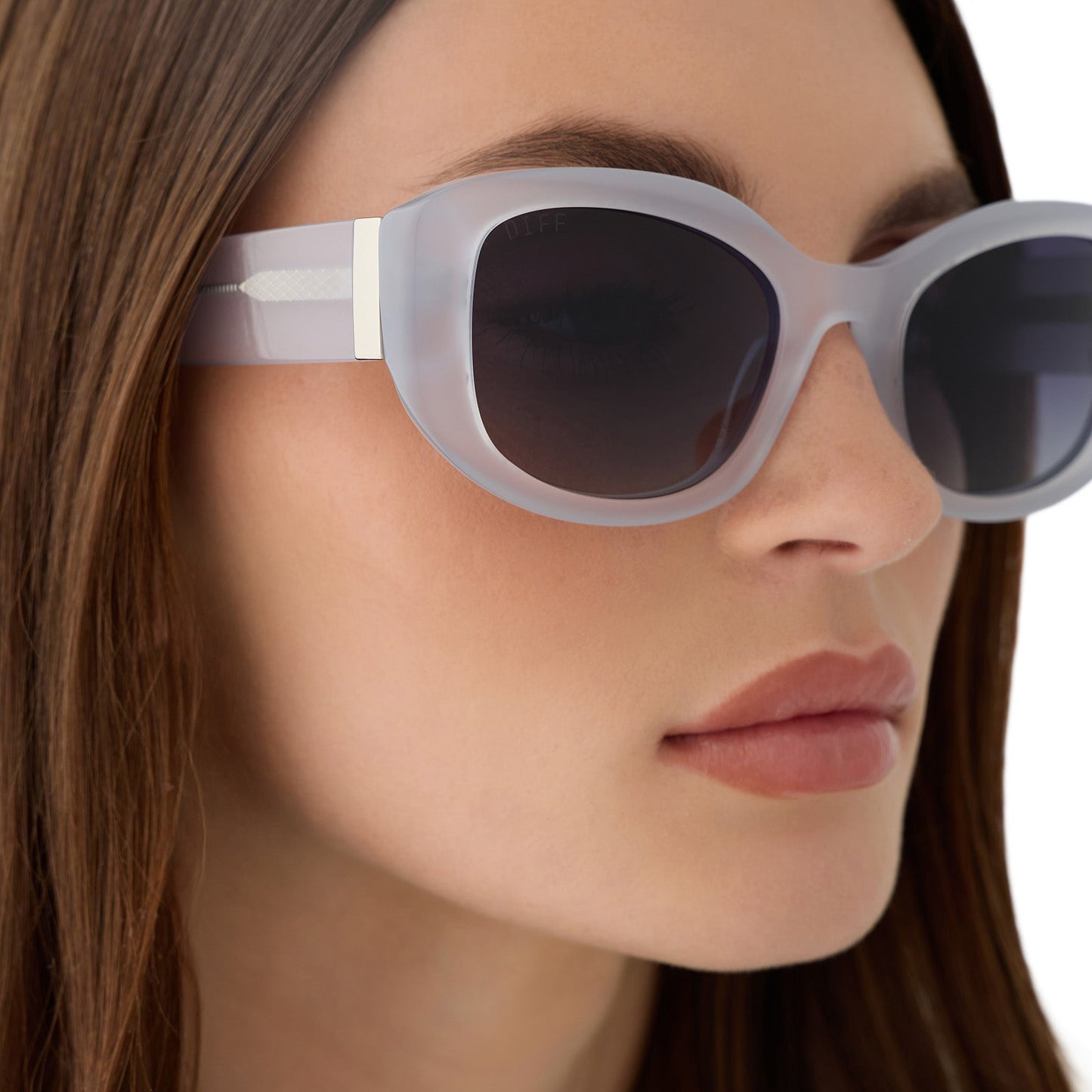 on model - female wearing the devil wears prada x diff eyewear featuring the miranda square oversized sunglasses with a milky white acetate frame and grey gradient polarized lenses detailed view