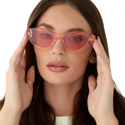 on model - female wearing for love and lemons x diff eyewear featuring the lucy cat eye sunglasses with a pastel pink frame and rose lenses front view