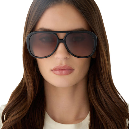 on model - female wearing for love and lemons x diff eyewear featuring the pauline aviator sunglasses with a black frame and brown gradient lenses front view