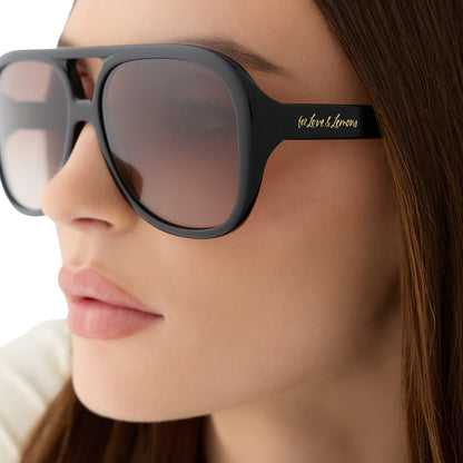 on model - female wearing for love and lemons x diff eyewear featuring the pauline aviator sunglasses with a black frame and brown gradient lenses detailed view