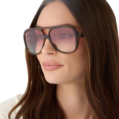 on model - female wearing for love and lemons x diff eyewear featuring the pauline aviator sunglasses with a honey tortoise frame and rose gradient lenses angled view