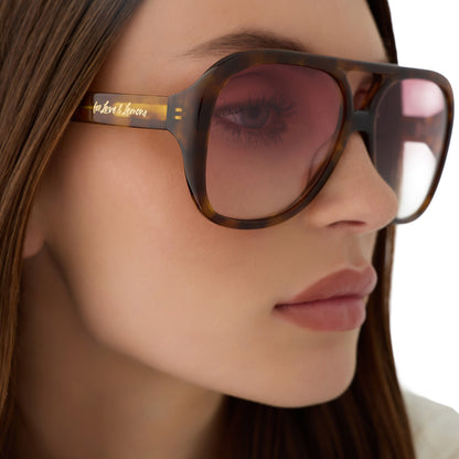 on model - female wearing for love and lemons x diff eyewear featuring the pauline aviator sunglasses with a honey tortoise frame and rose gradient lenses detailed view
