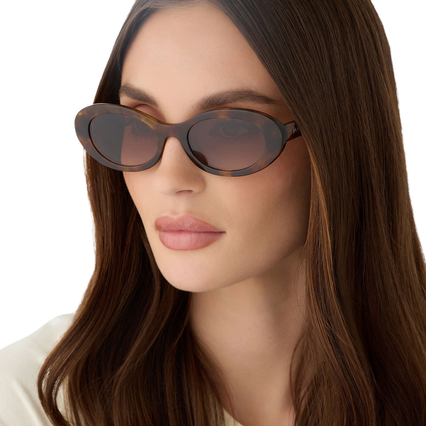 on model - female wearing for love and lemons x diff eyewear featuring the sabrina oval sunglasses with a honey tortoise frame and brown gradient lenses angled view