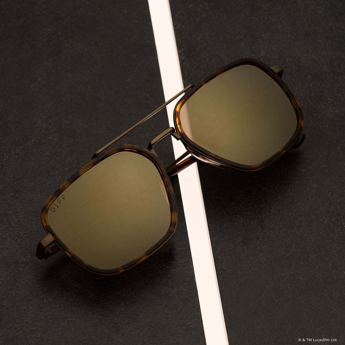 still life - star wars x diff eyewear the colonel ward navigator sunglasses with a bronze metal frame and brown flash lenses