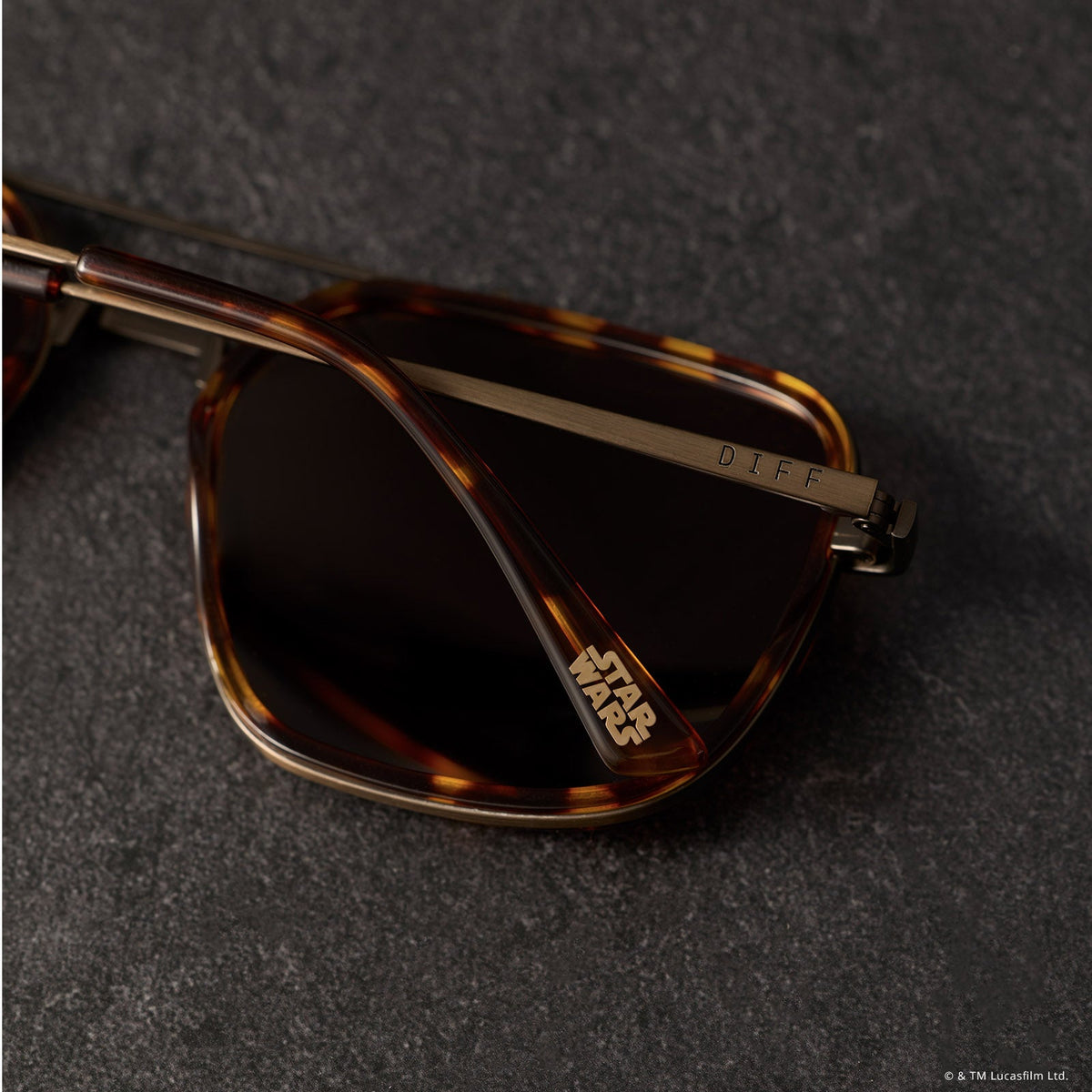still life - star wars x diff eyewear the colonel ward navigator sunglasses with a bronze metal frame and brown flash lenses detailed view