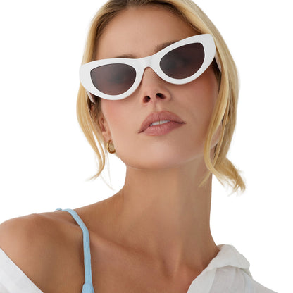on model - woman wearing beach riot x diff eyewear the mesa cat eye sunglasses with a white acetate frame and brown gradient lenses front view