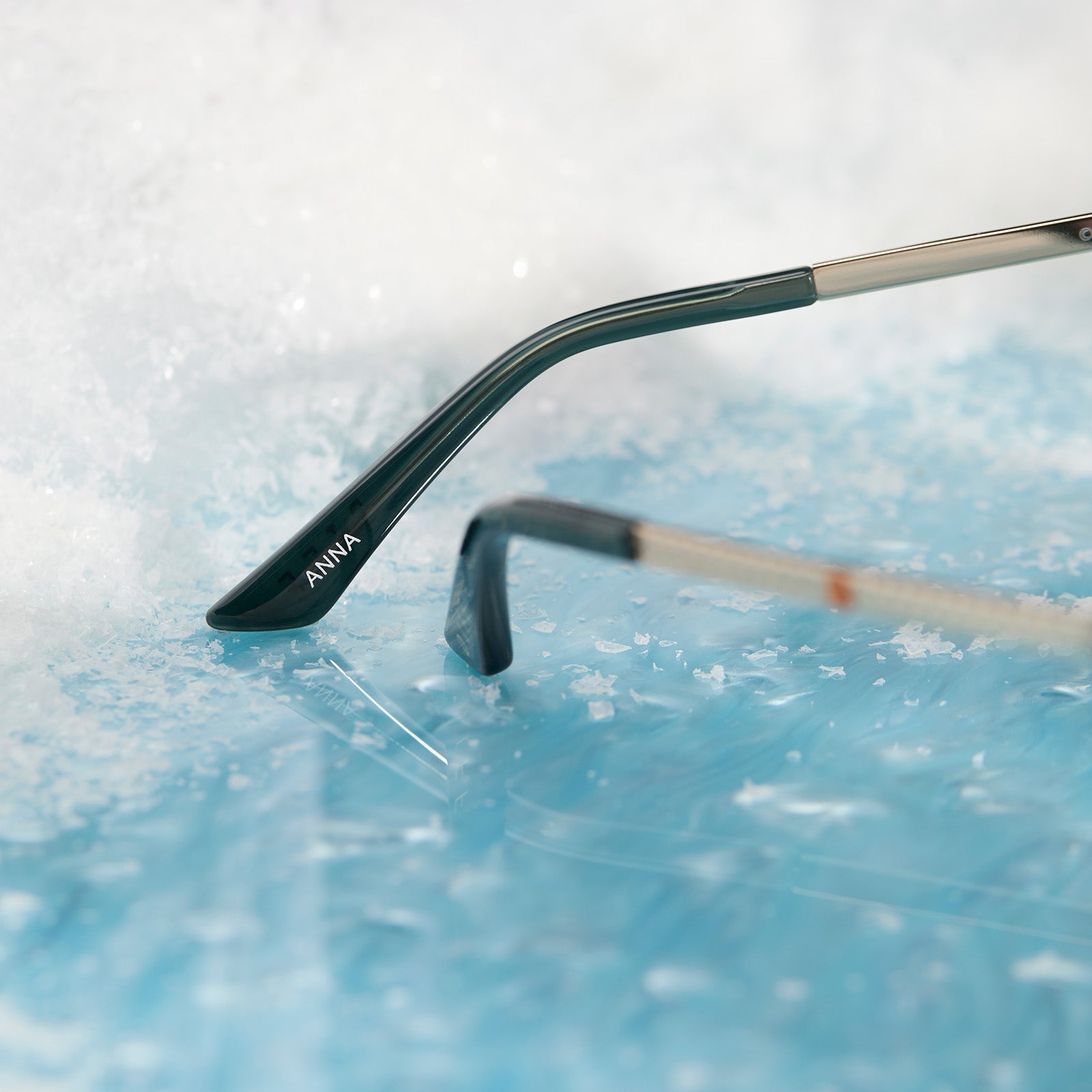 frozen x diff eyewear featuring the anna cat eye sunglasses with a rich emerald frame and royal purple gradient lenses temple tip view