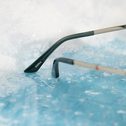 frozen x diff eyewear featuring the anna cat eye sunglasses with a rich emerald frame and royal purple gradient lenses temple tip view