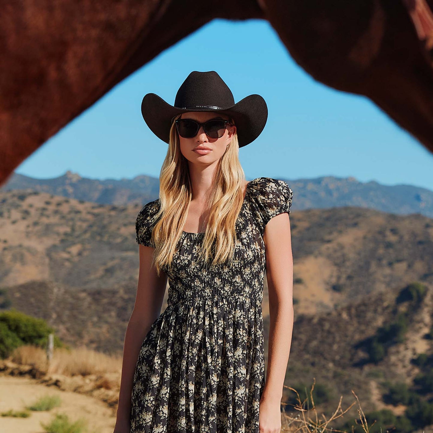 lifestyle - cowboy female with horse wearing yellowstone x diff eyewear featuring the beth iii cat eye sunglasses with a sequoia tortoise frame and g15 polarized lenses front view