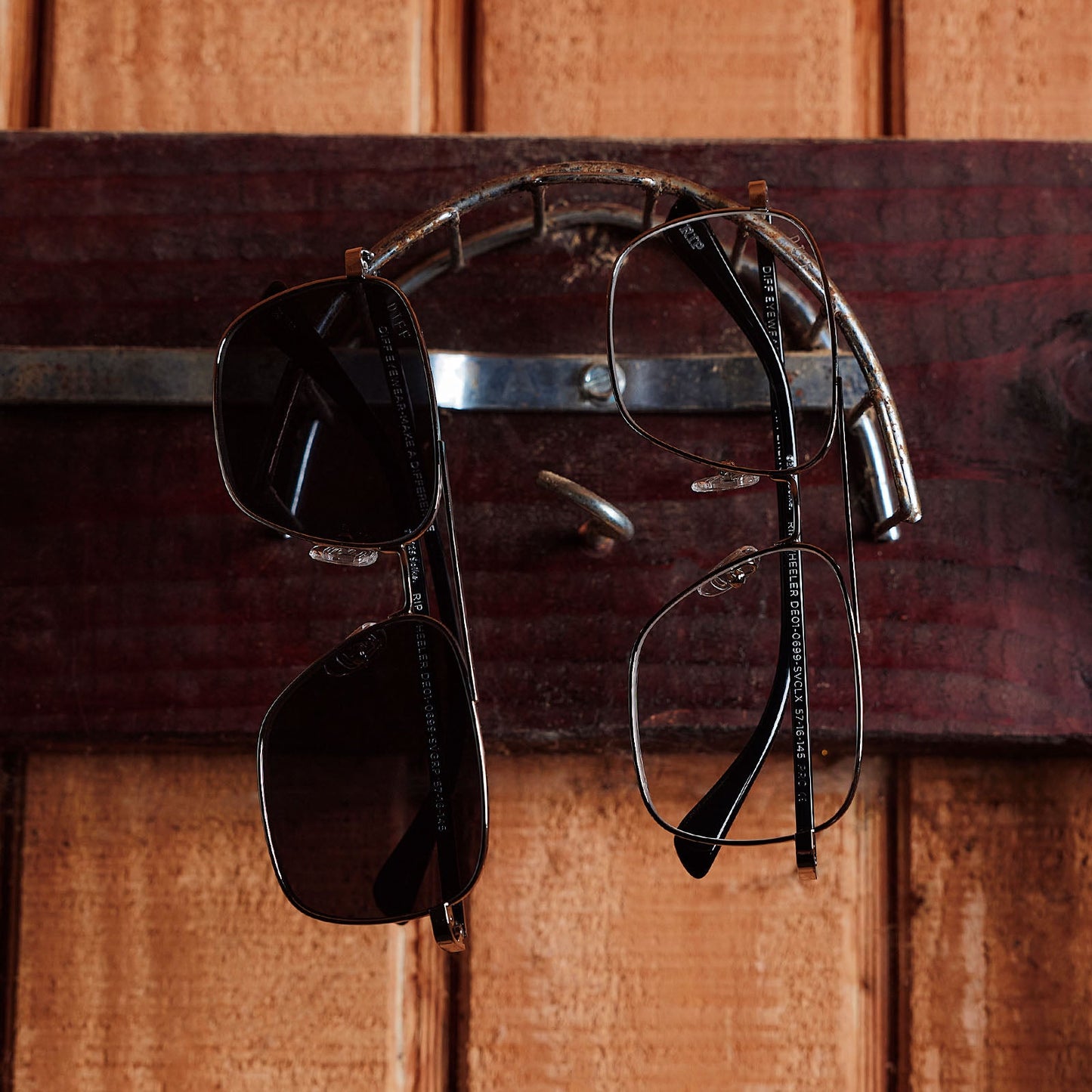 still life of yellowstone x diff eyewear featuring the rip wheeler navigator glasses with a silver frame front view