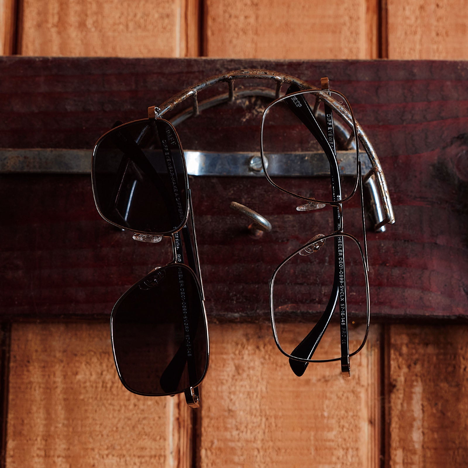 still life of yellowstone x diff eyewear featuring the rip wheeler navigator glasses with a silver frame front view