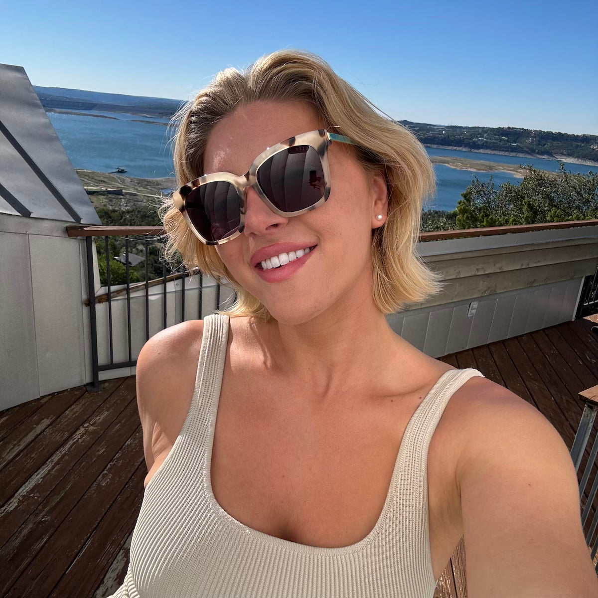 customer content - female with short blonde bob wearing diff eyewear bella square sunglasses with a cream tortoise frame and grey gradient polarized lenses