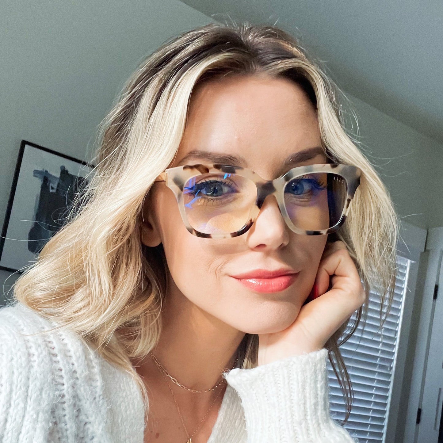 customer content - blonde female wearing BELLA XS - CREAM TORTOISE + BLUE LIGHT front