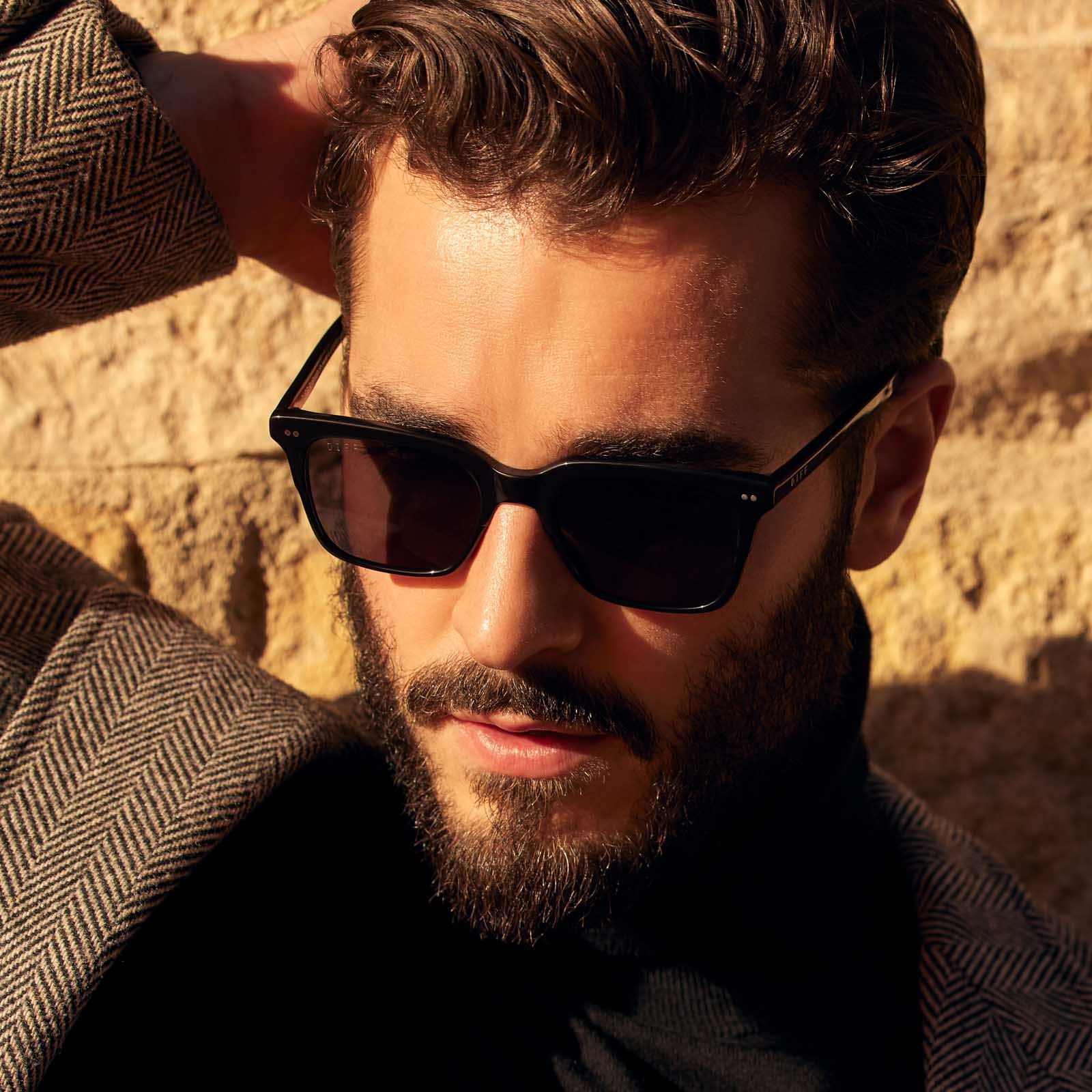 on model - male wearing billie square sunglasses with a black acetate frame and grey polarized lenses