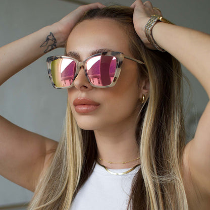 lifestyle - blonde female wearing Becky II sunglasses with cream tortoise frame and pink mirror lens