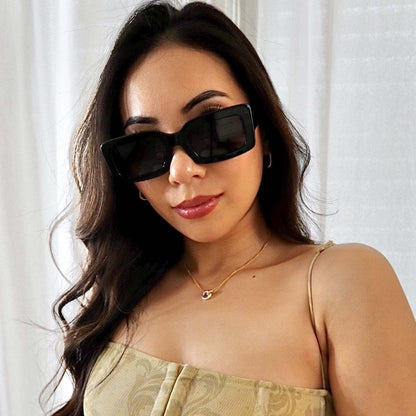 customer content - brunette female wearing diff eyewear indy rectangular sunglasses with a black acetate frame and grey polarized lenses front view