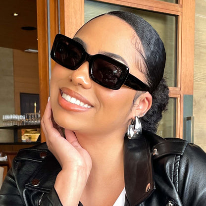 customer content - female wearing diff eyewear indy rectangular sunglasses with a black acetate frame and grey polarized lenses