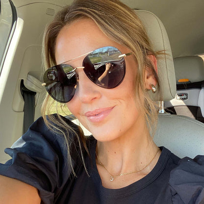 customer content - blonde female wearing diff eyewear lenox aviator sunglasses with a gold metal frame and blue gradient polarized lenses