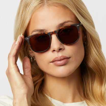 on model - woman wearing diff eyewear featuring the maxwell xl square sunglasses with a matte rich tortoise frame and brown polarized lenses front view