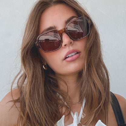 on model - female wearing aspyn ovard x diff eyewear featuring the lola square prescription sunglasses with a tortoise frame front view
