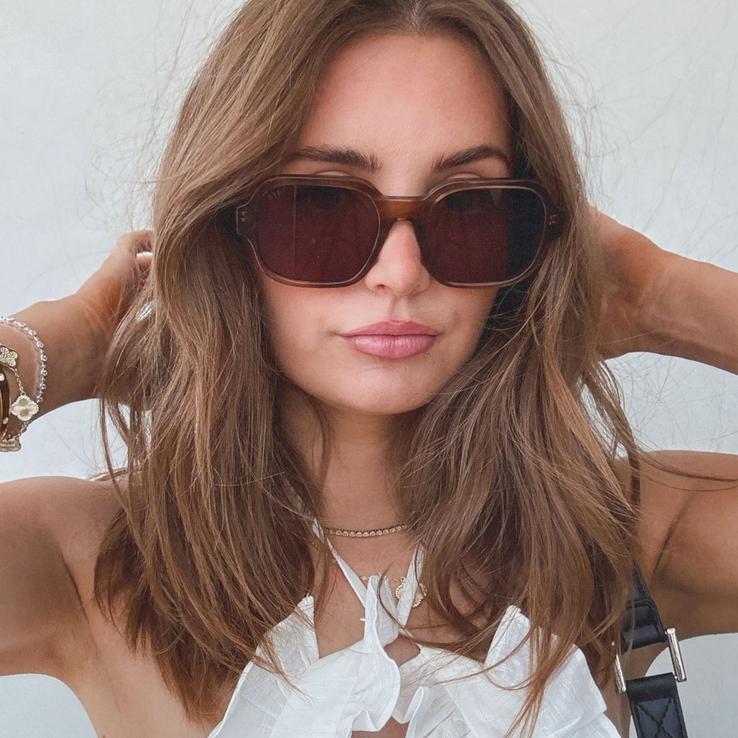 on model - female wearing aspyn ovard x diff eyewear featuring the lola square prescription sunglasses with a tortoise frame angled view