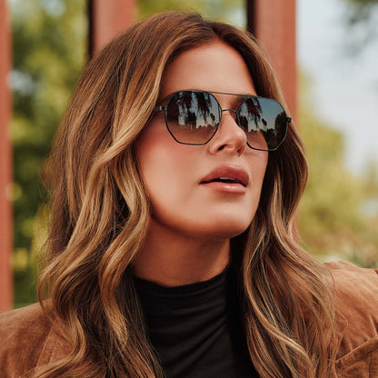 lifestyle - female jojo fletcher wearing diff eyewear joelle navigator sunglasses with a black metal frame and grey gradient lenses front view
