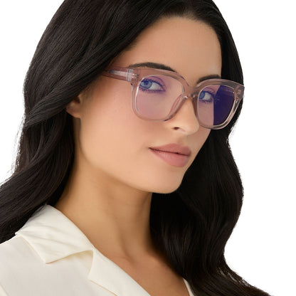 on model - female wearing diff eyewear featuring the ava square blue light readers with a light pink crystal frame angled view