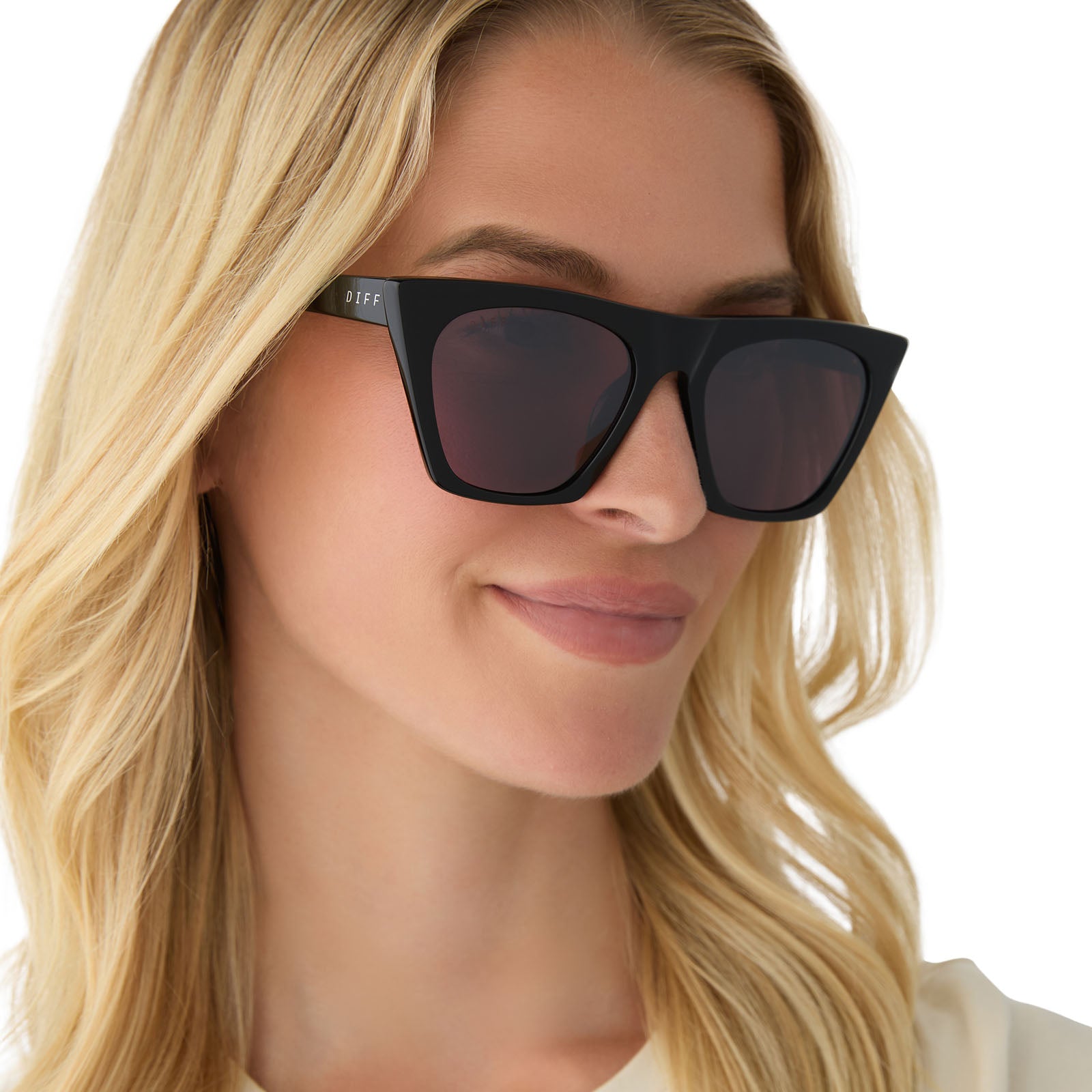 on model - female wearing diff eyewear featuring the avril cat eye sunglasses with a black frame and aubergine with silver flash lenses front view