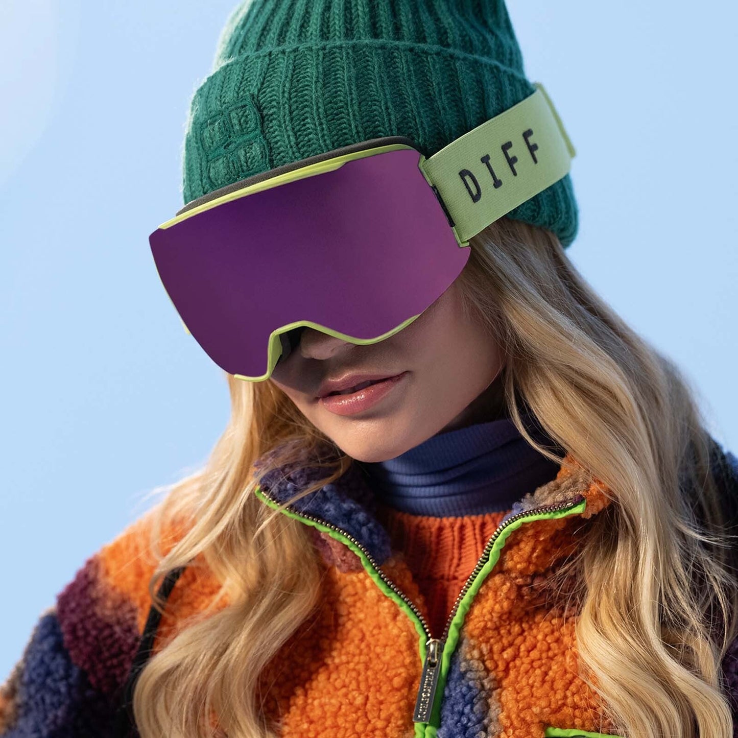 on model - blonde woman wearing pink snow goggles