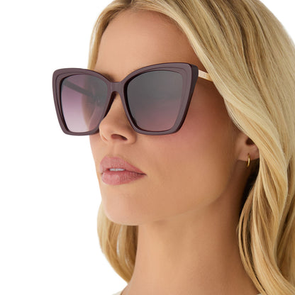 on model - female wearing diff eyewear featuring the becky ii cateye sunglasses with a dark cherry lacquer frame and dark cherry gradient polarized lenses angled view