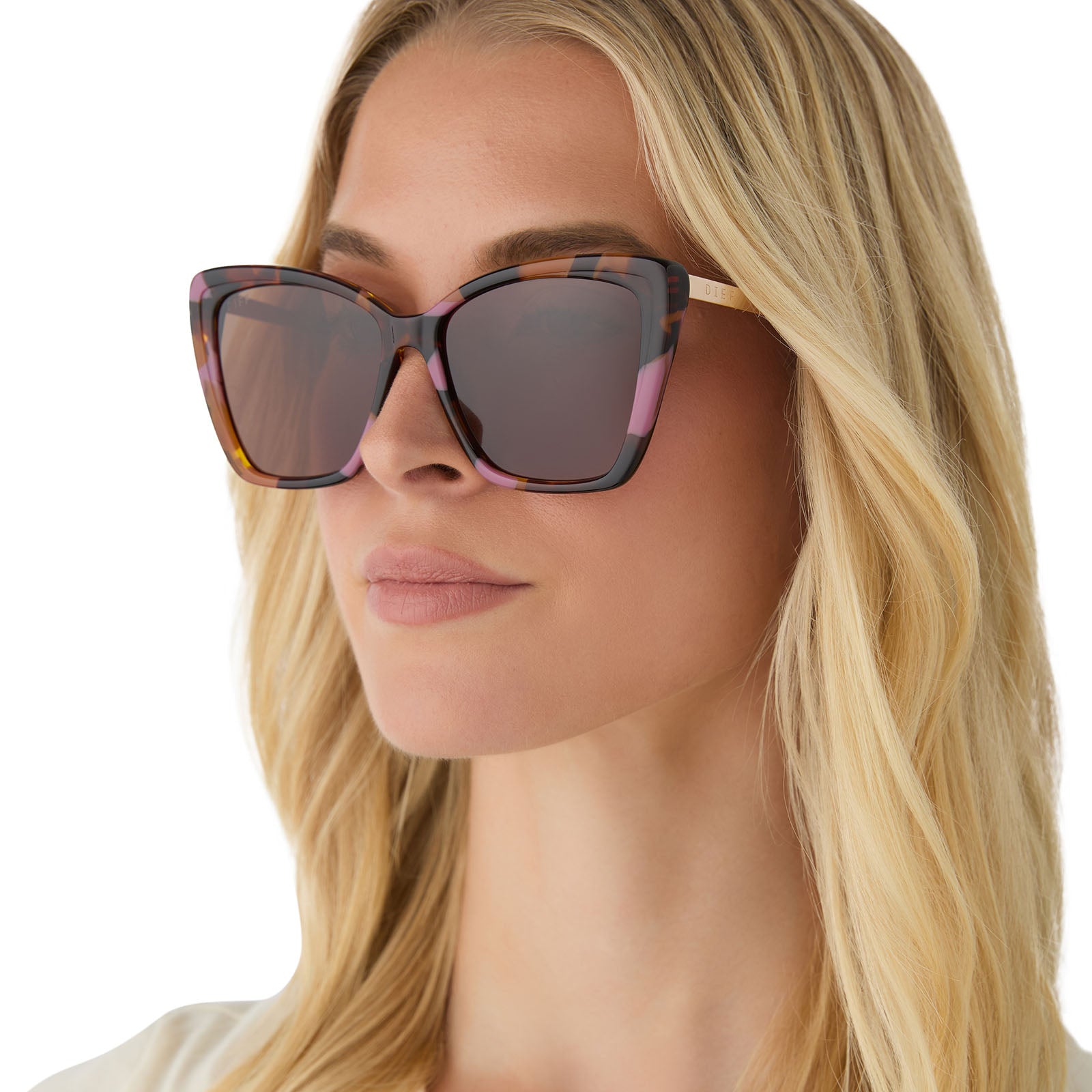 on model - female wearing diff eyewear featuring the becky ii cat eye sunglasses with a gold + torino tort temple tips frame and brown polarized lenses angled view