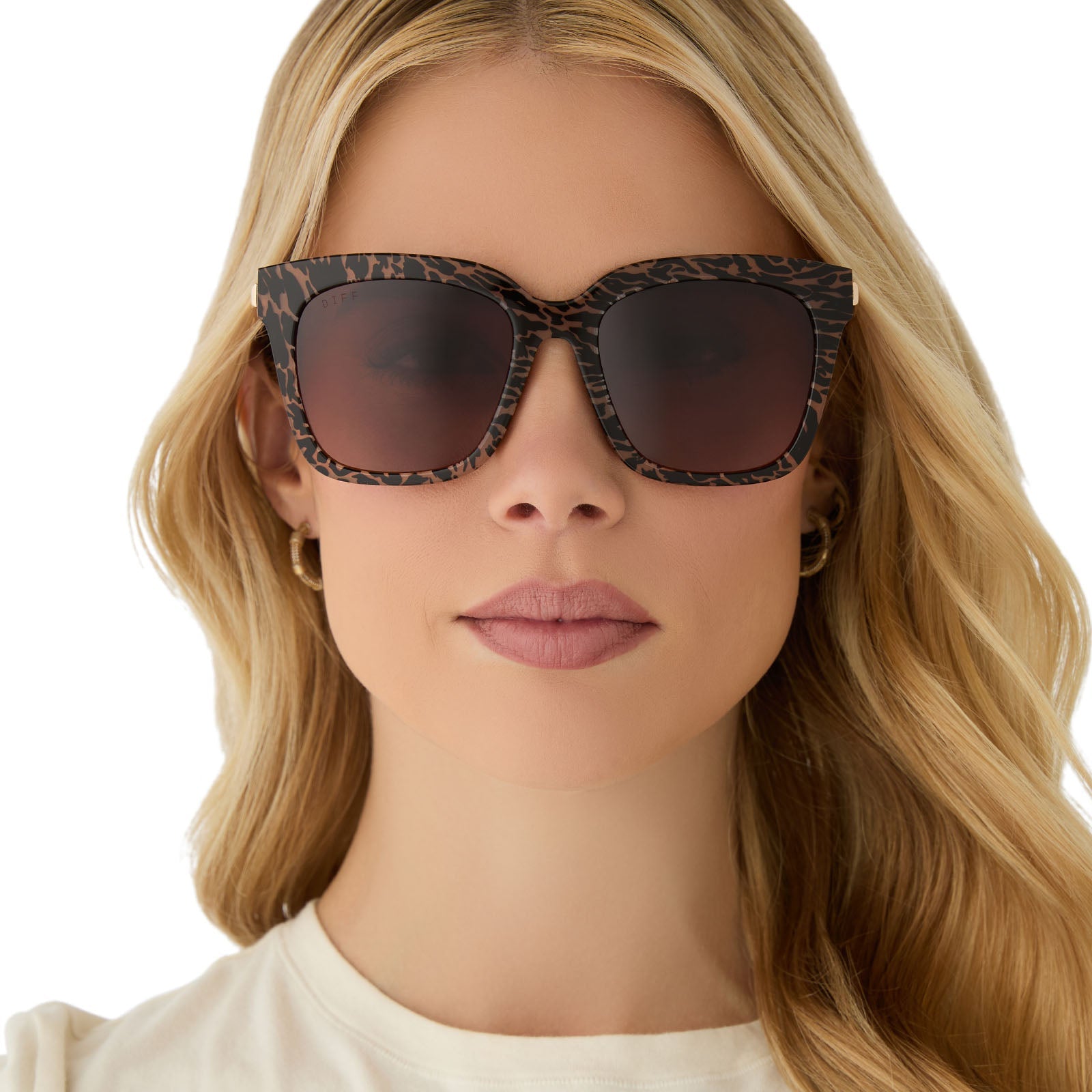 on model - female wearing diff eyewear featuring the bella square sunglasses with a animal print frame and brown gradient lenses front view