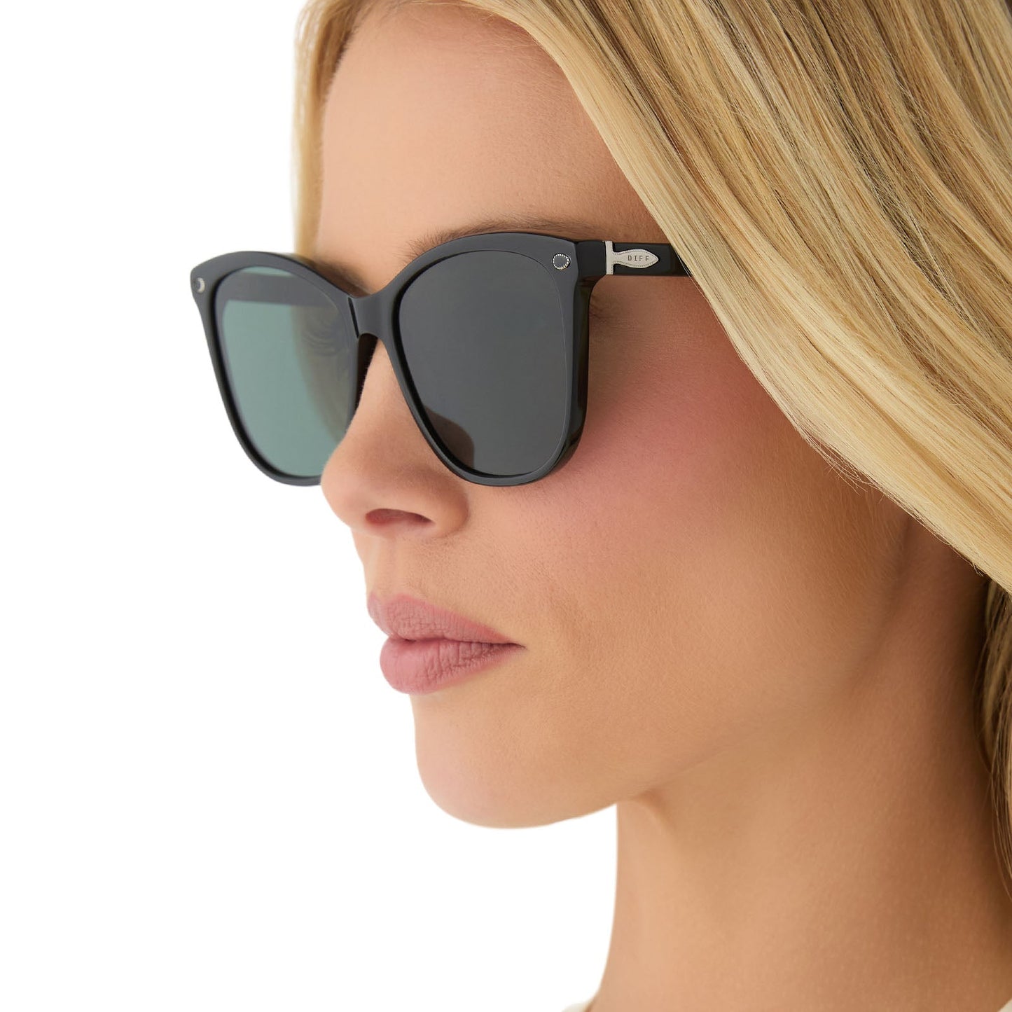 on model - female wearing yellowstone x diff eyewear featuring the beth iii cat eye sunglasses with a black frame and grey lenses angled view