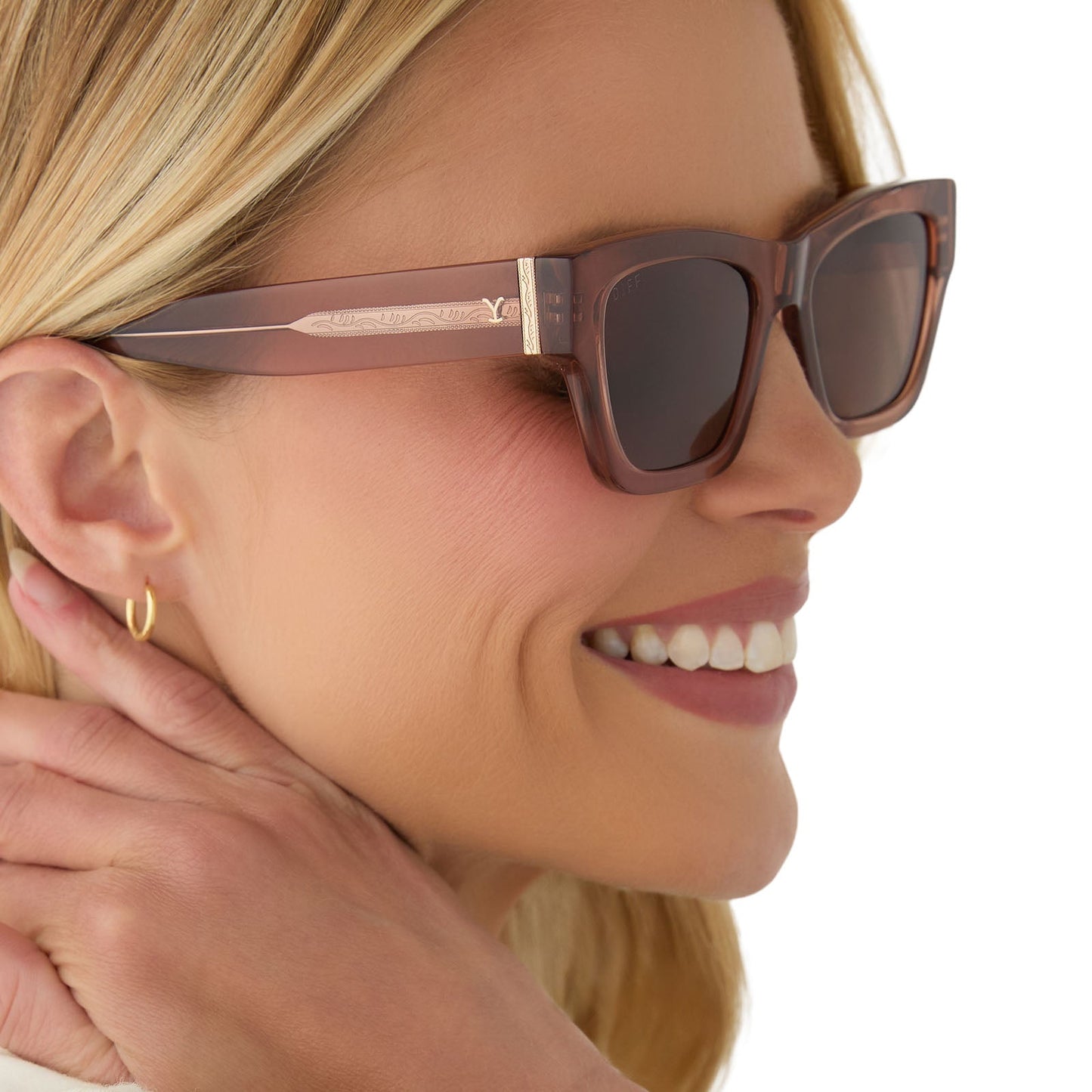 on model - female wearing yellowstone x diff eyewear featuring the beth ii cat eye sunglasses with a cafe ole frame and brown polarized lenses angled view