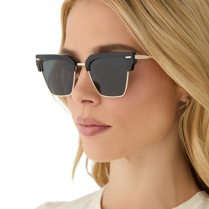 on model - female wearing diff eyewear featuring the capri rectangle sunglasses with a black frame and grey polarized lenses side view