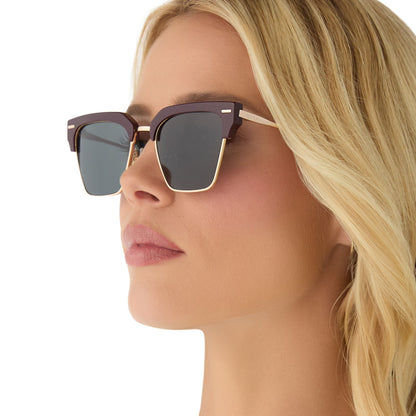 on model - female wearing diff eyewear featuring the capri rectangle sunglasses with a dark cherry lacquer frame and grey polarized lenses angled view