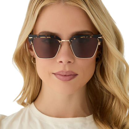 on model - female wearing diff eyewear featuring the capri rectangle sunglasses with a espresso tort frame and brown lenses front view