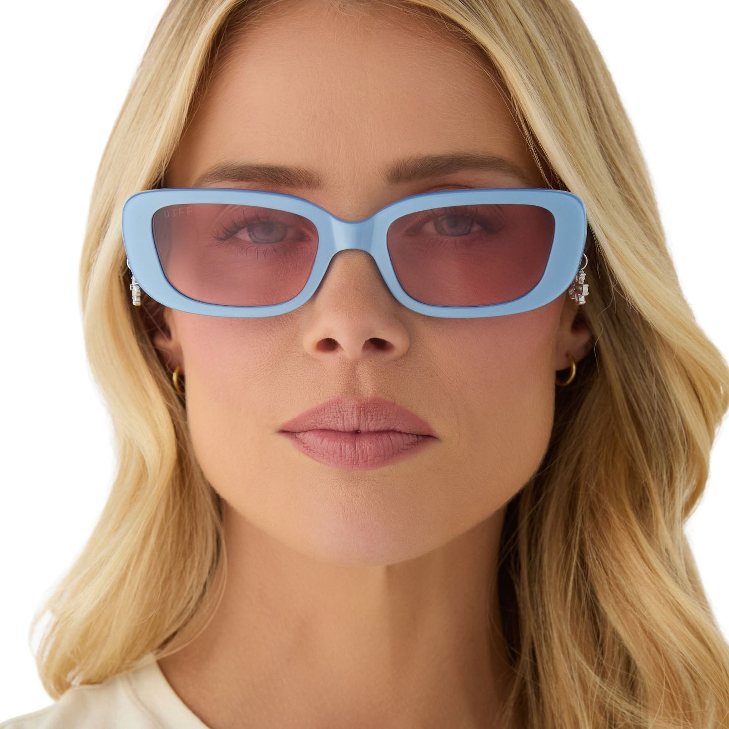 on model - female wearing clueless x diff eyewear featuring the cher round sunglasses with a light blue frame and pink gradient lenses front view