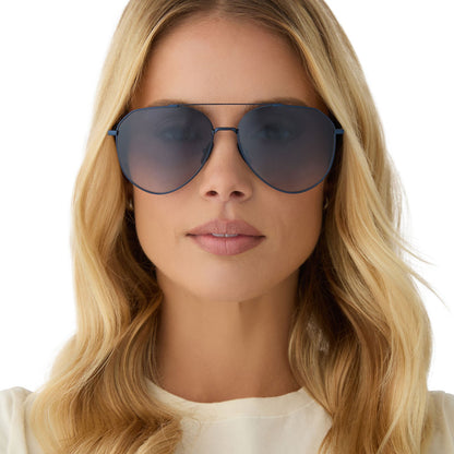 on model - female wearing diff eyewear featuring the dash aviator sunglasses with a deep navy metal frame and aegean blue flash lenses front view