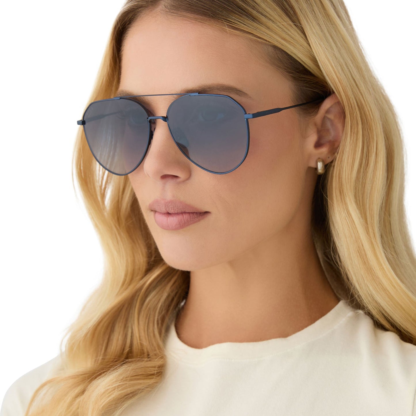 on model - female wearing diff eyewear featuring the dash aviator sunglasses with a deep navy metal frame and aegean blue flash lenses angled view